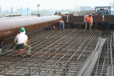 Formwork and reinforcement installation for the cut-and-cover construction within the permanent sheet piles
