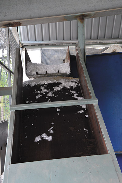 Polyfiber being dosed into the concrete mix